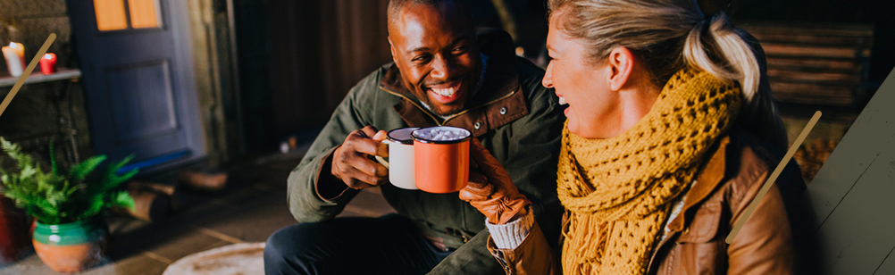 couple having hot chocolate on patio