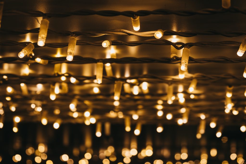 Starry Christmas lights hanging from a ceiling. 