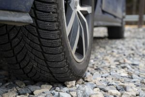 car tire on gravel road