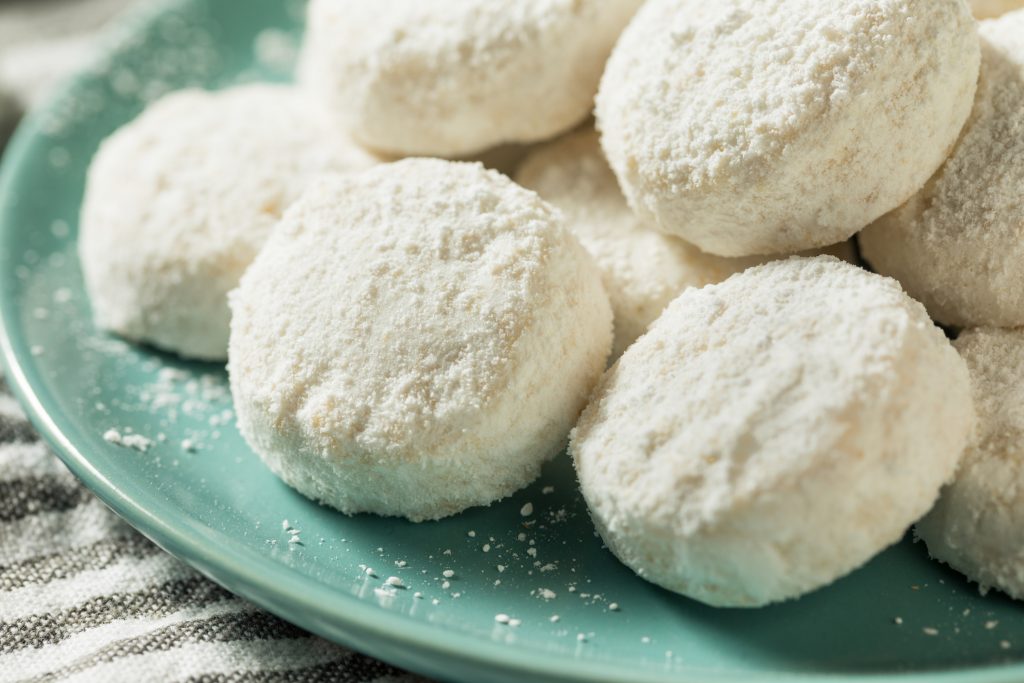 snowball cookies on teal plate