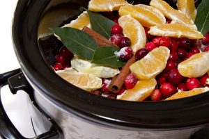 slow cooker with oranges and cranberries