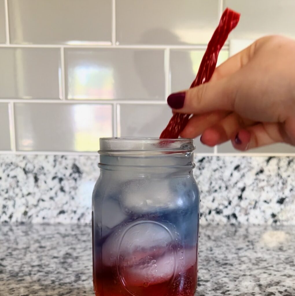 adding twizzler straw to mason jar