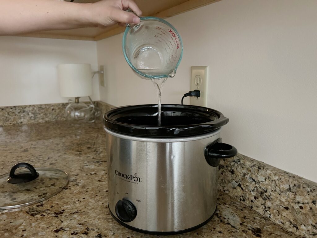pouring water in slow cooker