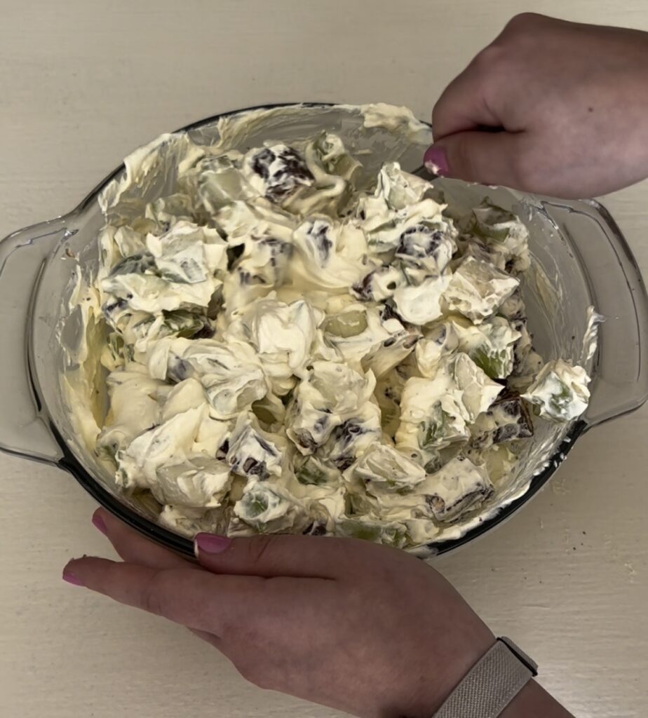 mixing Snickers salad