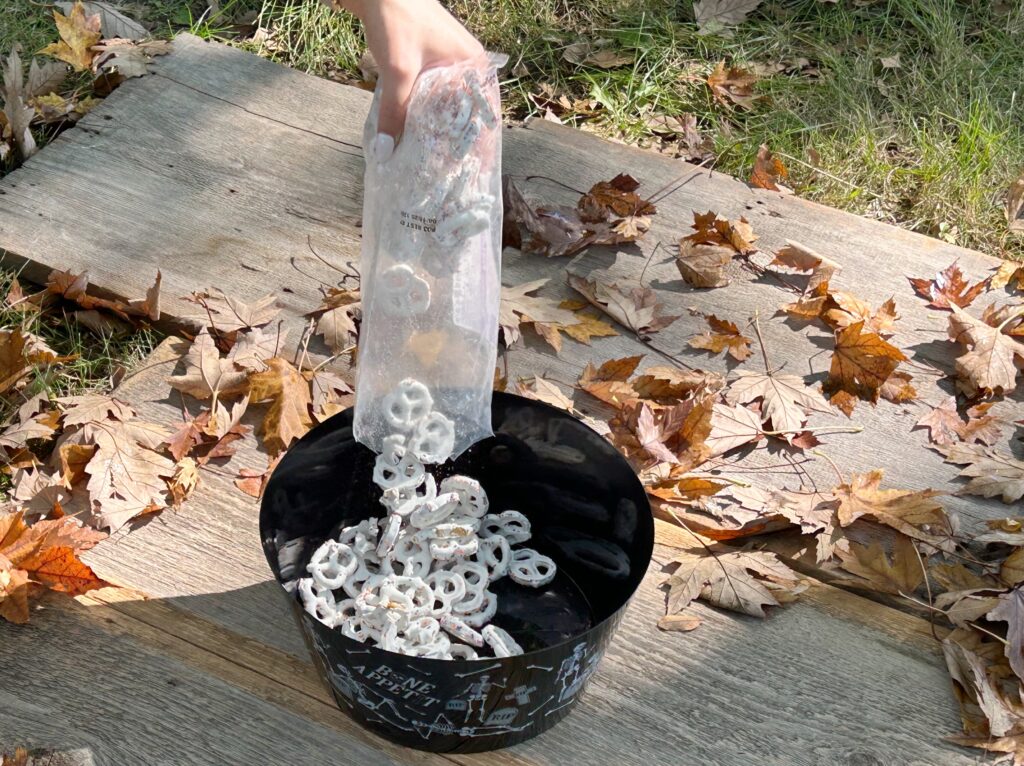 pouring pretzels in bowl