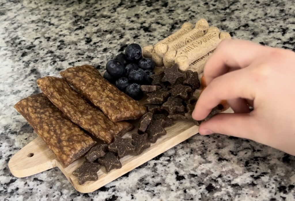 adding training treats to board