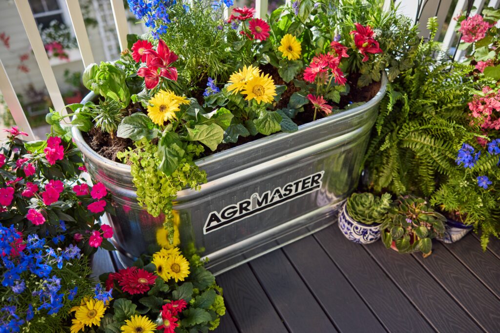 stock tank planter filled with flowers