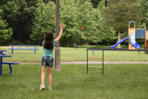 girl playing ladder ball